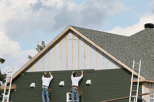 Professional Siding Replacement technician working in Windsor, CO